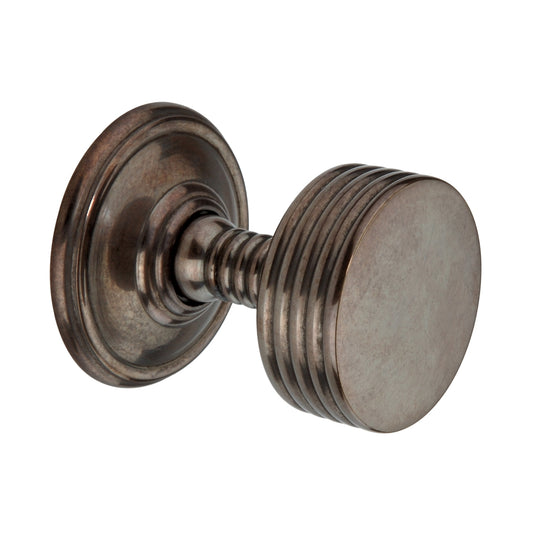 Oxford Mortice Door Knob in Antique finish, crafted from solid forged brass with a ribbed texture, featuring a 58mm diameter knob and 70mm diameter inseparable rose from the Spira Brass range.