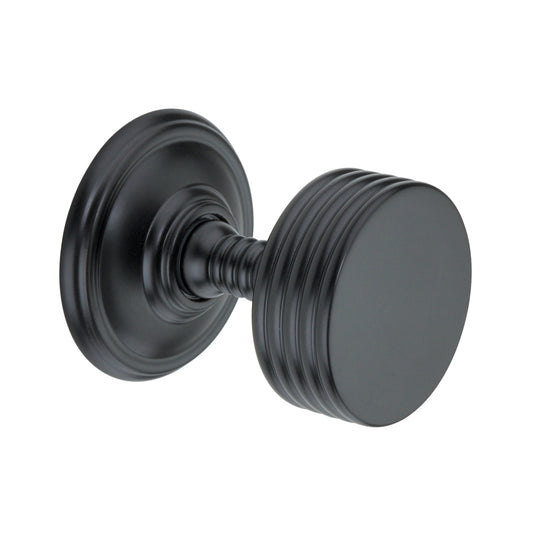 Mortice door knob with ribbed texture in matt black finish, 58mm diameter, part of the Oxford range.