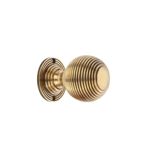 Reeded 60mm door knob in aged brass for mortice applications, featuring an elegant design by Spira Brass.