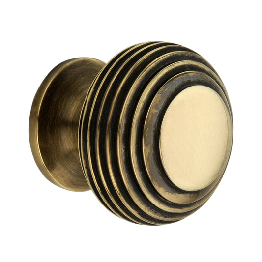 Beehive Small Cupboard Knob in Aged Brass, 30mm size, showcasing modern design and ergonomic functionality for cabinetry enhancement.
