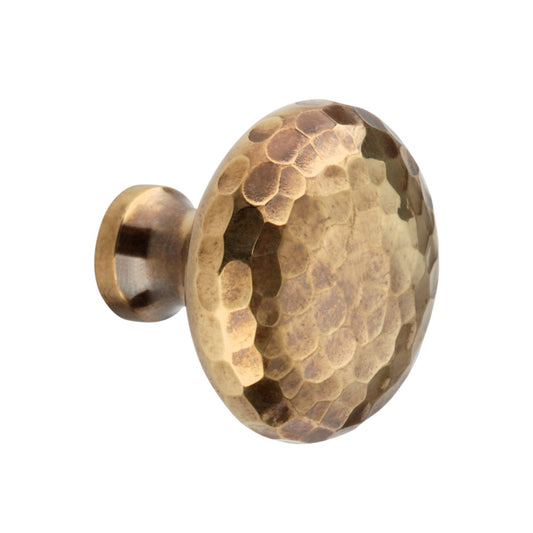Hammered Mushroom Cupboard Knob in Aged Brass, 38mm, by Spira Brass, showcasing a unique texture and ergonomic design for stylish cabinetry enhancement.