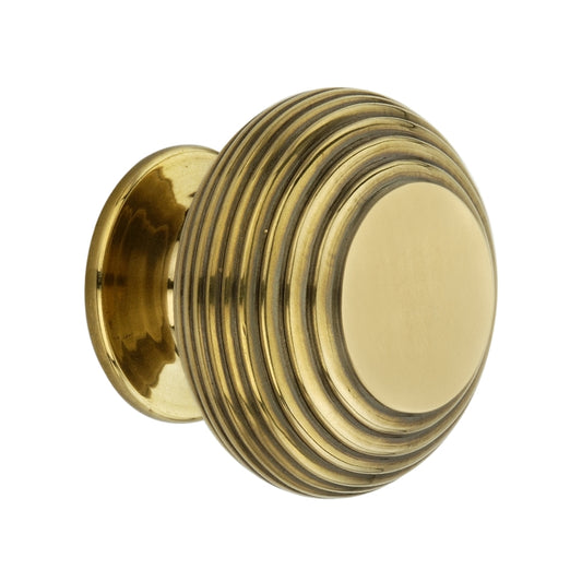 Large Beehive Cupboard Knob in Aged Brass, 40mm, featuring an ergonomic reeded design for enhanced grip and elegance in cabinetry.