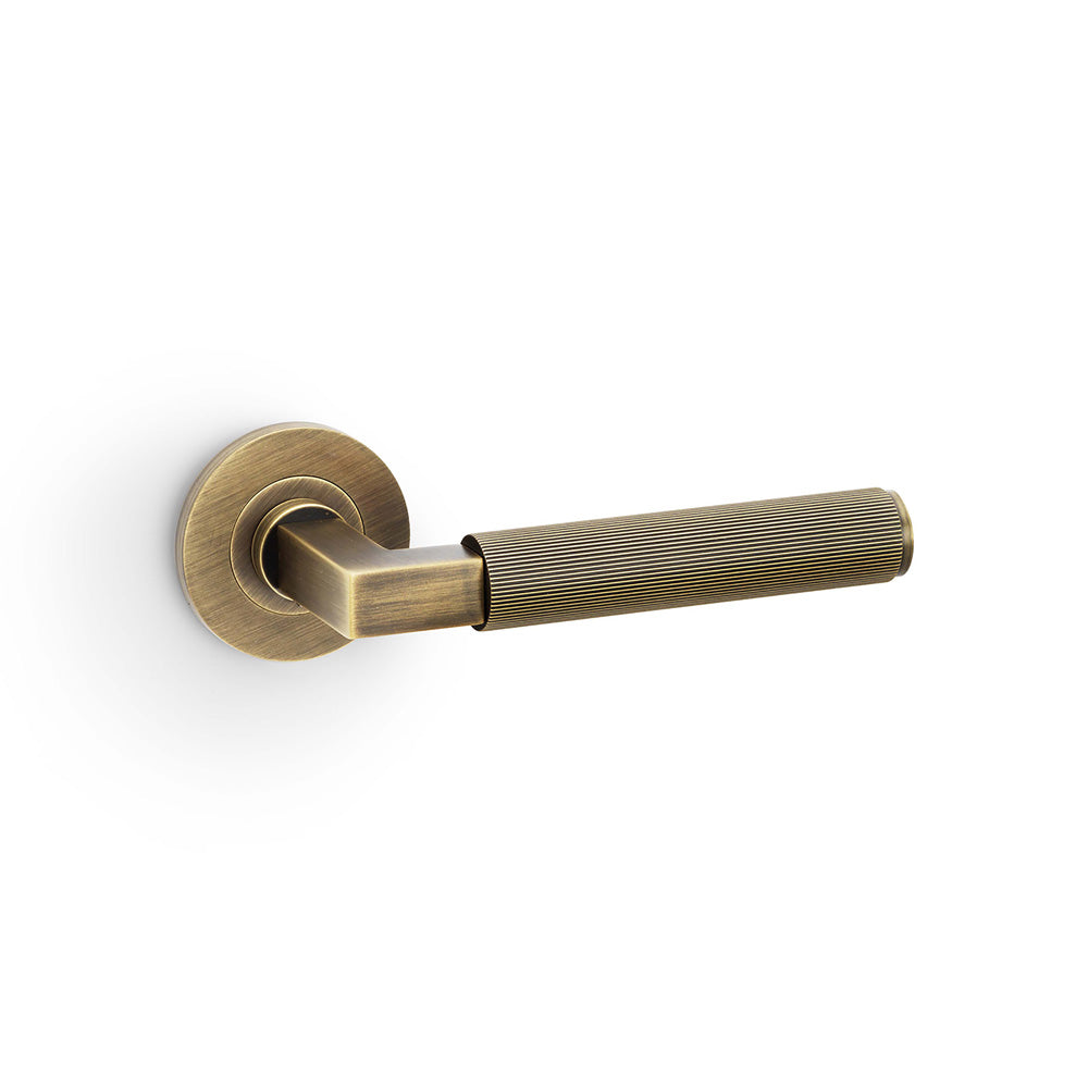 Hurricane Reeded Lever Door Handle – Antique Brass