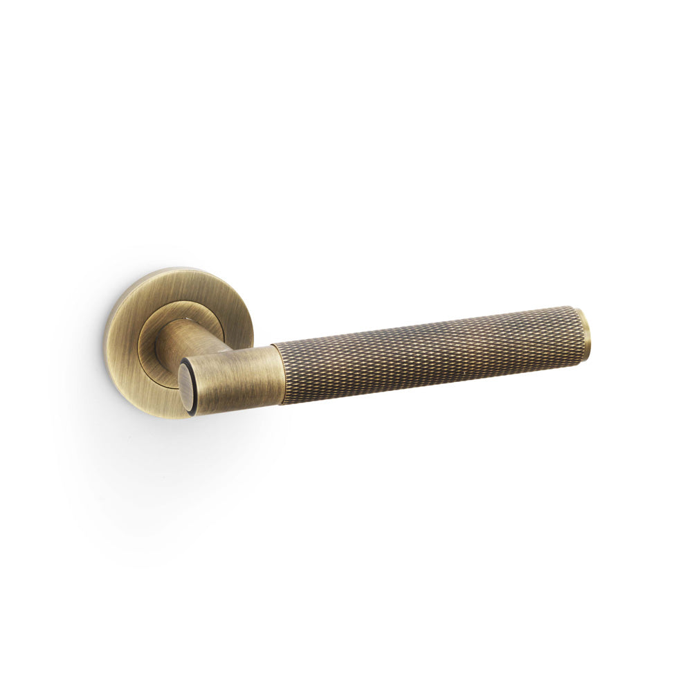 Spitfire Knurled Lever Door Handle on Round Rose - Antique Brass