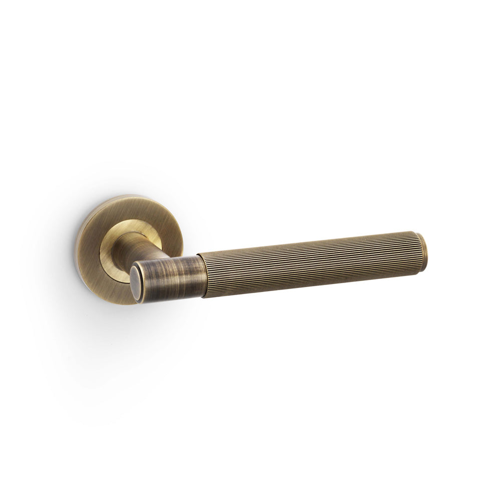 Spitfire Reeded Lever Door Handle – Antique Brass