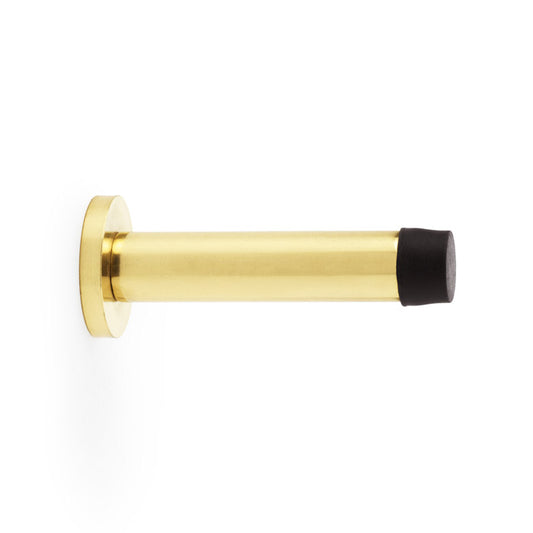 Polished Brass Lacquered Cylinder Projection Door Stop by Alexander & Wilks, featuring a sleek rose base and concealed fixings.