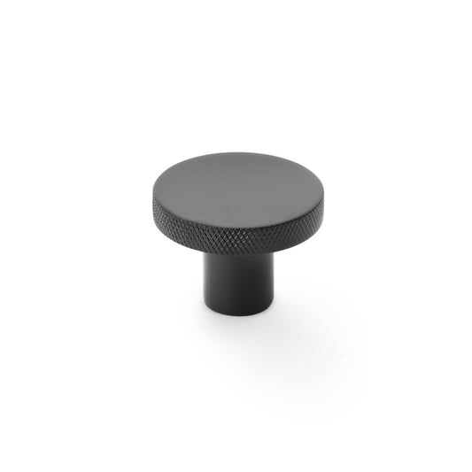 Black knurled circular cupboard knob by Alexander & Wilks, 38mm, showcasing industrial design and solid brass construction