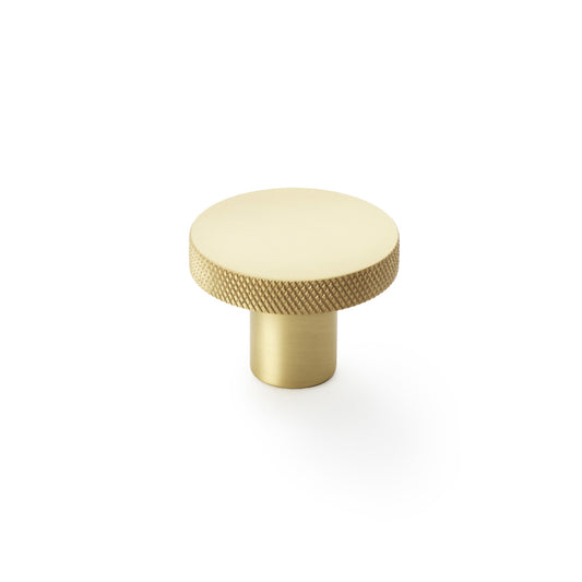Alexander & Wilks knurled circular cupboard knob in satin brass, 38mm, showing durable and stylish design with tactile grip.