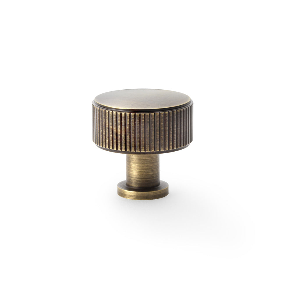 Antique brass reeded cupboard knob by Alexander & Wilks Lucia, 35mm, showcasing textured grip and elegant finish