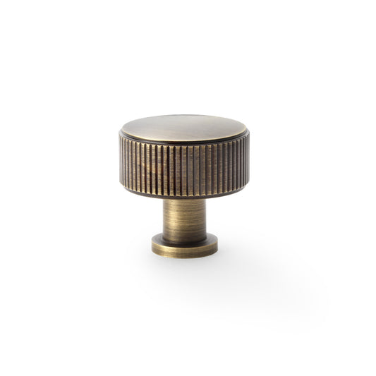 Antique brass reeded cupboard knob by Alexander & Wilks Lucia, 35mm, showcasing textured grip and elegant finish
