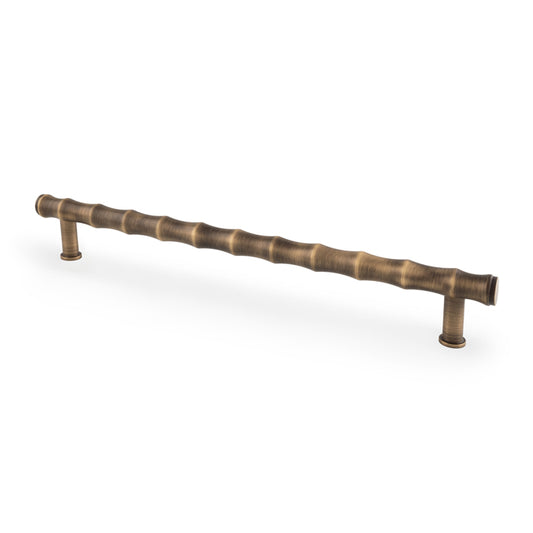 Bamboo T-bar Cupboard Pull Handle in Antique Brass Finish by Alexander & Wilks, 224mm Centres, showcasing bamboo-inspired design and ergonomic features