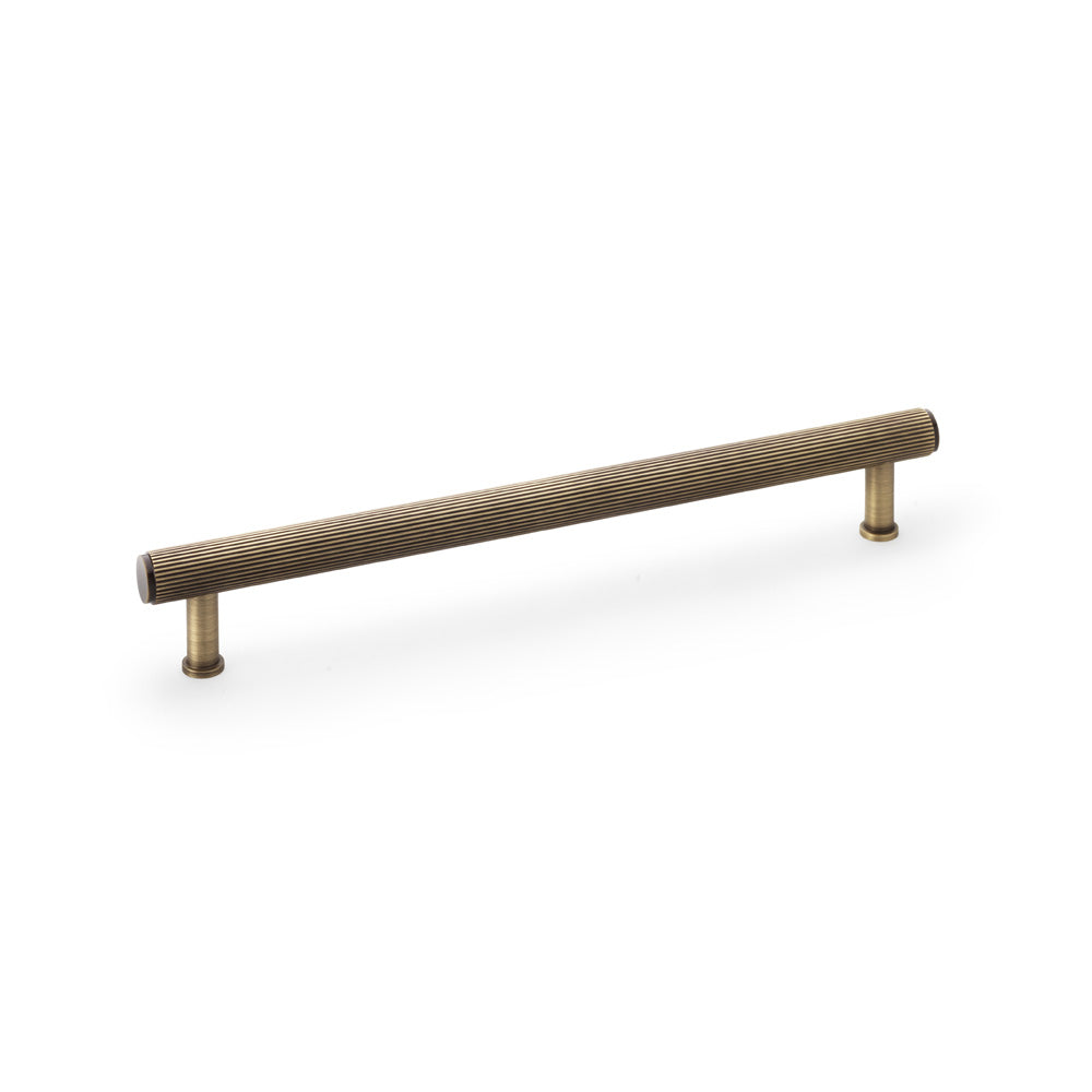 Antique brass reeded T-bar cupboard pull handle by Alexander & Wilks Crispin, 224mm center-to-center, solid brass with textured grip