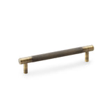 "Antique Brass Knurled T-Bar Cupboard Handle by Alexander & Wilks with diamond texture and classic finish, ideal for enhancing interior spaces"