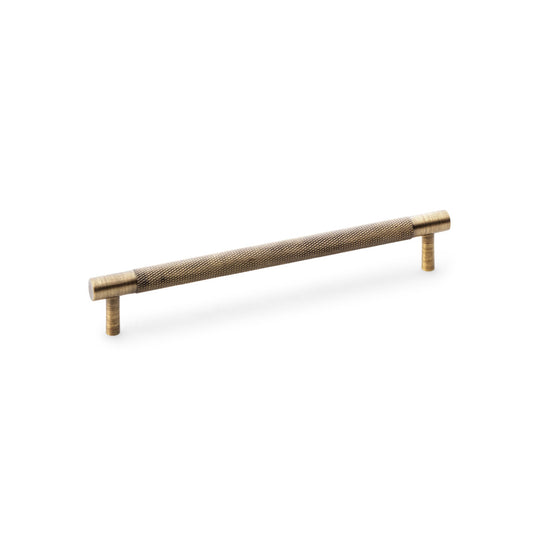 Knurled T-Bar Cupboard Handle by Alexander & Wilks in Antique Brass, showing detailed knurled texture and classic finish, ideal for enhancing grip and style in home or commercial settings.