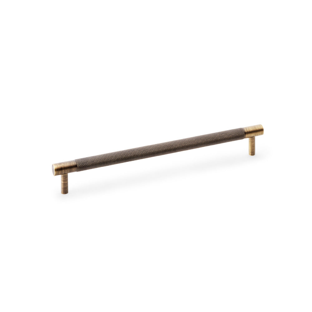 "Antique Brass Knurled T-Bar Cupboard Handle by Alexander & Wilks, 224mm centre spacing, ideal for enhancing both modern and traditional interiors"