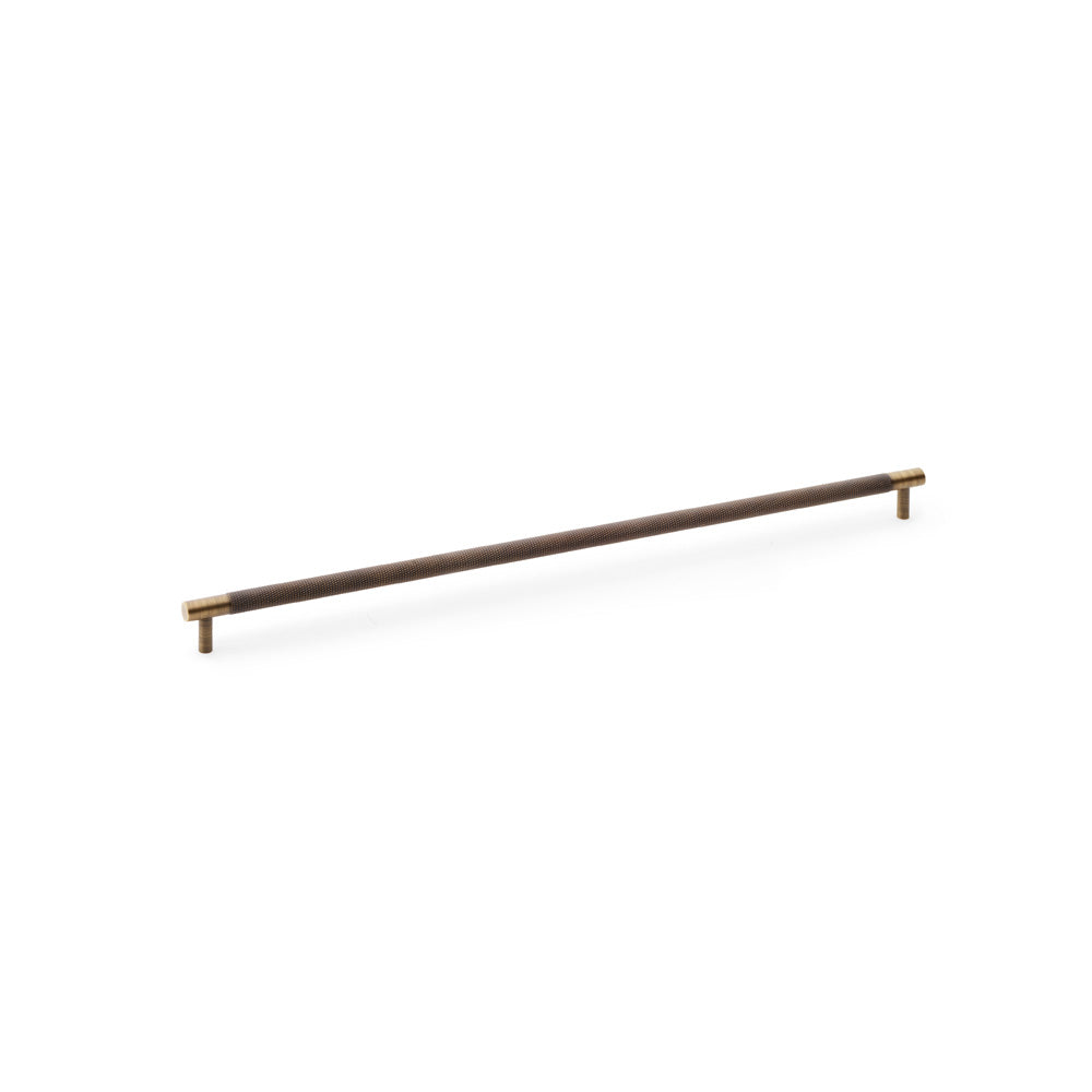 Alexander & Wilks knurled T-Bar cupboard handle in antique brass, 448mm centres, showing diamond knurled design and solid brass material.