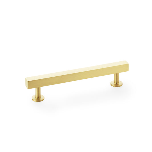 Square T-Bar Cabinet Pull Handle in Satin Brass by Alexander and Wilks, 128mm centres, displayed on a white background