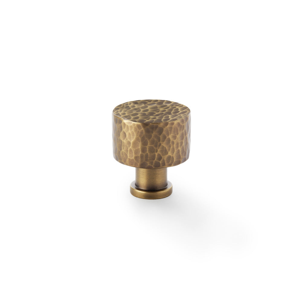"Alexander and Wilks Leila hammered cupboard knob in antique brass 30mm, showing distinctive textured design and solid brass material"