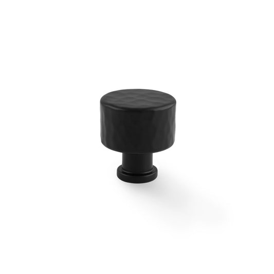 Alt text: "Alexander & Wilks Leila hammered cupboard knob in black, 30mm, featuring solid brass construction and a textured finish, ideal for traditional and modern décor styles."