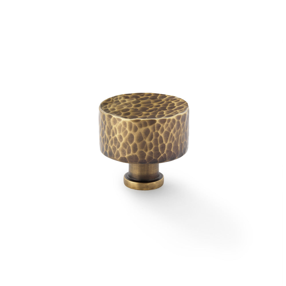 "Alexander and Wilks Leila Hammered Cupboard Knob in Antique Brass, 35mm, elegant hammered design suitable for traditional and contemporary decor"