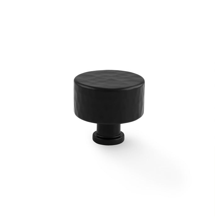 "Alexander & Wilks Leila Hammered Cupboard Knob in black with solid brass and traditional hammered effect"