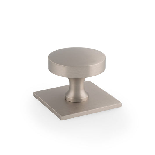 "Satin Nickel Bullion Cupboard Knob on Square Backplate by Alexander & Wilks, highlighting elegant circular style and solid brass construction"