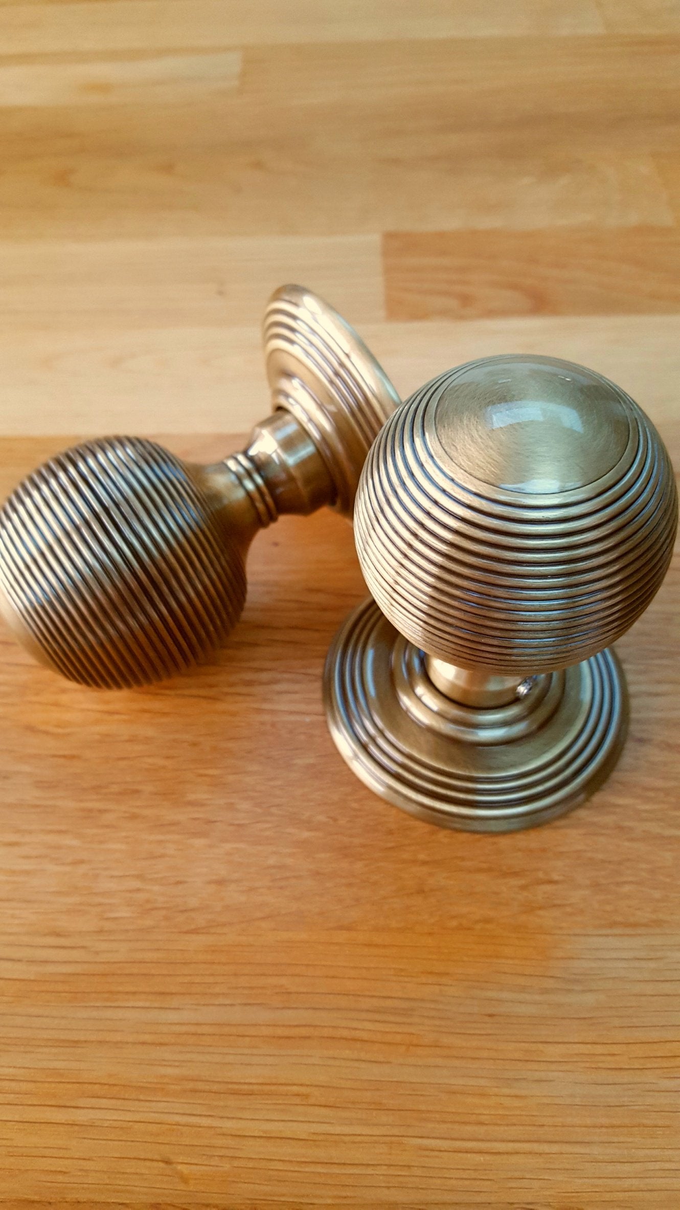 Lifestyle image of JR8MAB Frelan Hardware Reeded Antique Brass Door Knobs