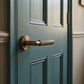 Piccadilly Knurled Lever Door Handles - Burlington Range - Antique Brass, BUR40AB - fitted on a door
