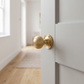 Beehive Reeded Mortice Door Knobs In Satin Brass - fitted on a door