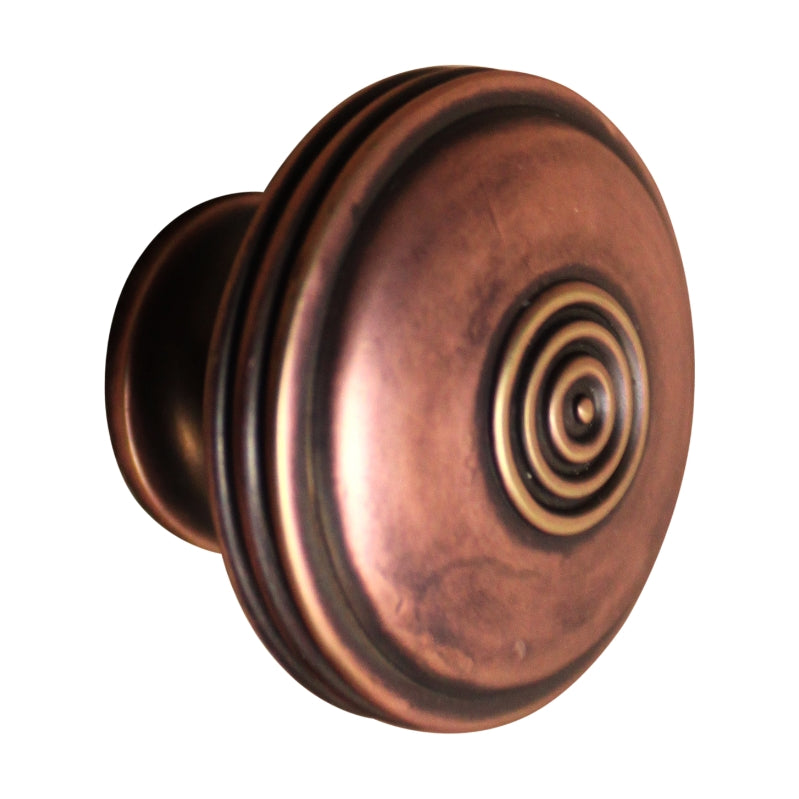 Large 40mm cupboard knob in aged bronze with reeded texture, designed by Bloxwich for elegant cabinetry enhancement.