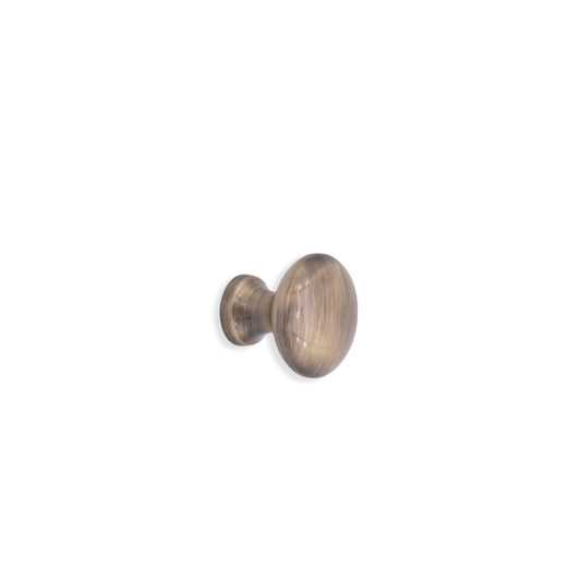 Mushroom cupboard knob in antique brass, 25mm size, featuring an ergonomic design for comfortable grip and elegant cabinetry enhancement.