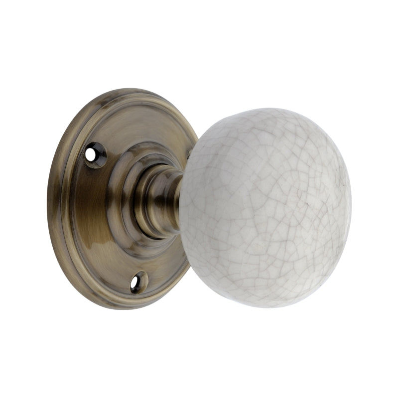Crackled Porcelain Mortice Door Knob in Antique Brass, 60mm diameter, part of the Spira Brass range, showcasing timeless elegance and modern durability.