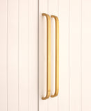 Curve Bar Cabinet Handle in Satin Brass, large size 460mm x 25mm, showcasing solid brass construction for modern elegance in wardrobes and cupboards.