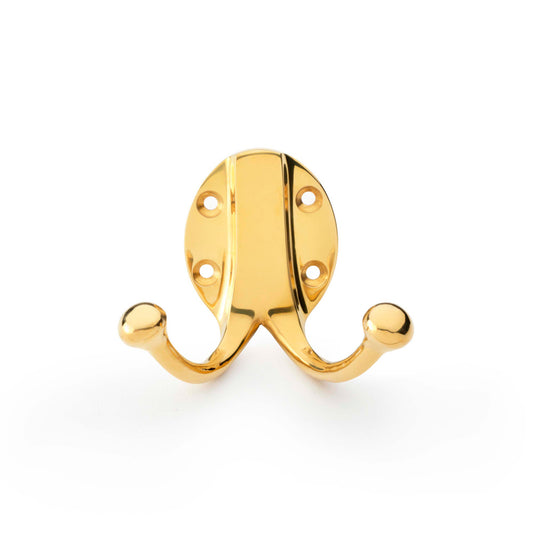 Traditional Double Robe Hook in Unlacquered Brass by Alexander & Wilks, showing dual hooks on a classic oval backplate, ideal for enhancing home decor.
