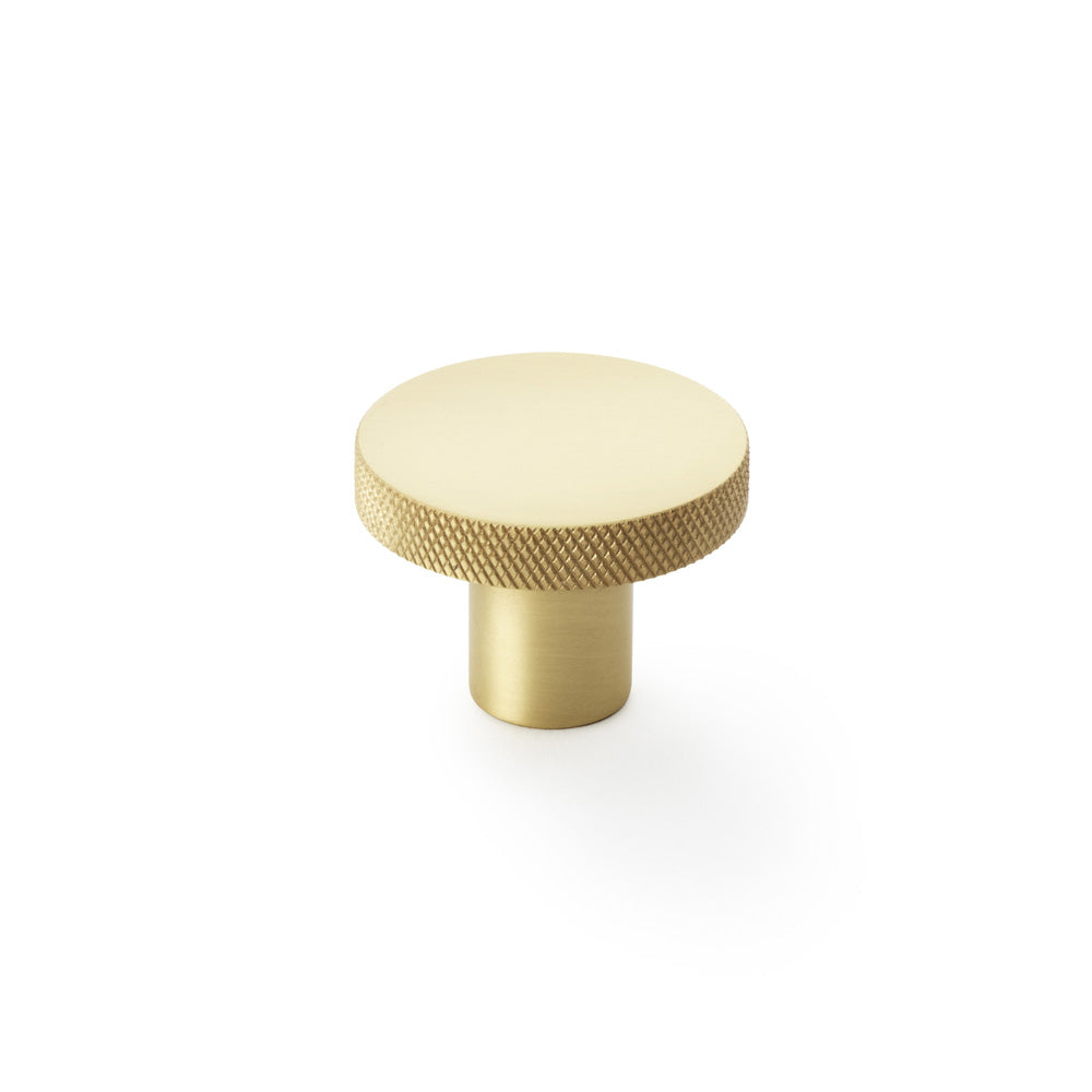 Alexander & Wilks knurled circular cupboard knob in satin brass, 38mm, showing durable and stylish design with tactile grip.