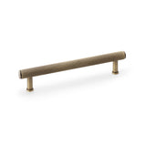 Alexander & Wilks Crispin Reeded T-bar Cupboard Pull Handle in Antique Brass, 160mm on display