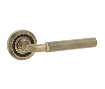 Antique Brass Parisian Lever Door Handles on Round Rose