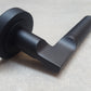 Matt Black Engineered Lever Door Handles On Round Rose
