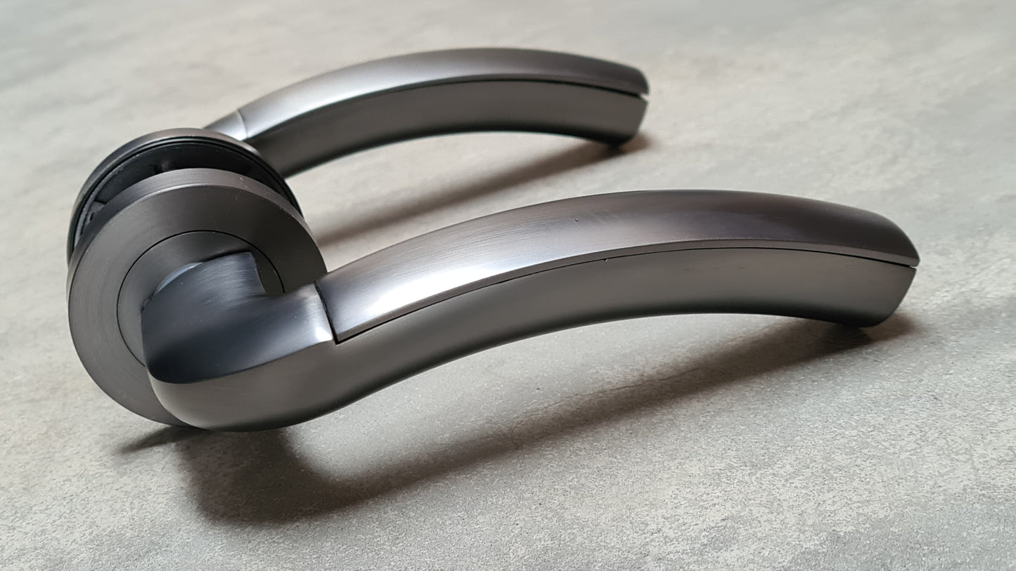 Curve Gun Metal Grey Door Handles on Round Rose