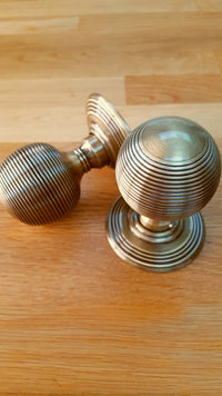 Thumbnail for Lifestyle image of JR8MAB Frelan Hardware Reeded Antique Brass Door Knobs