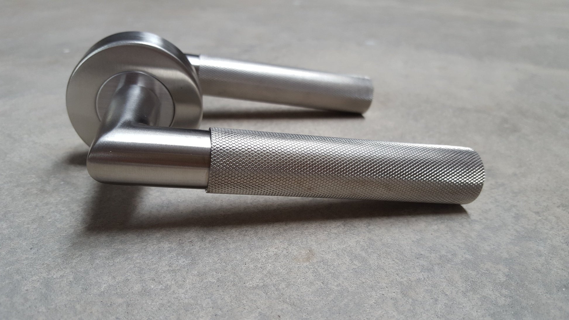 Stainless Steel Knurled Door Lever Handle On Round Rose