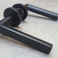 Mitred Matt Black Door Lever Handles on Round Rose