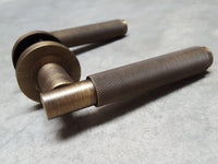 Thumbnail for Antique Brass Varese Knurled Lever Door Handles on Round Rose - EUL050AB - Finishes Collection by Carlisle Brass